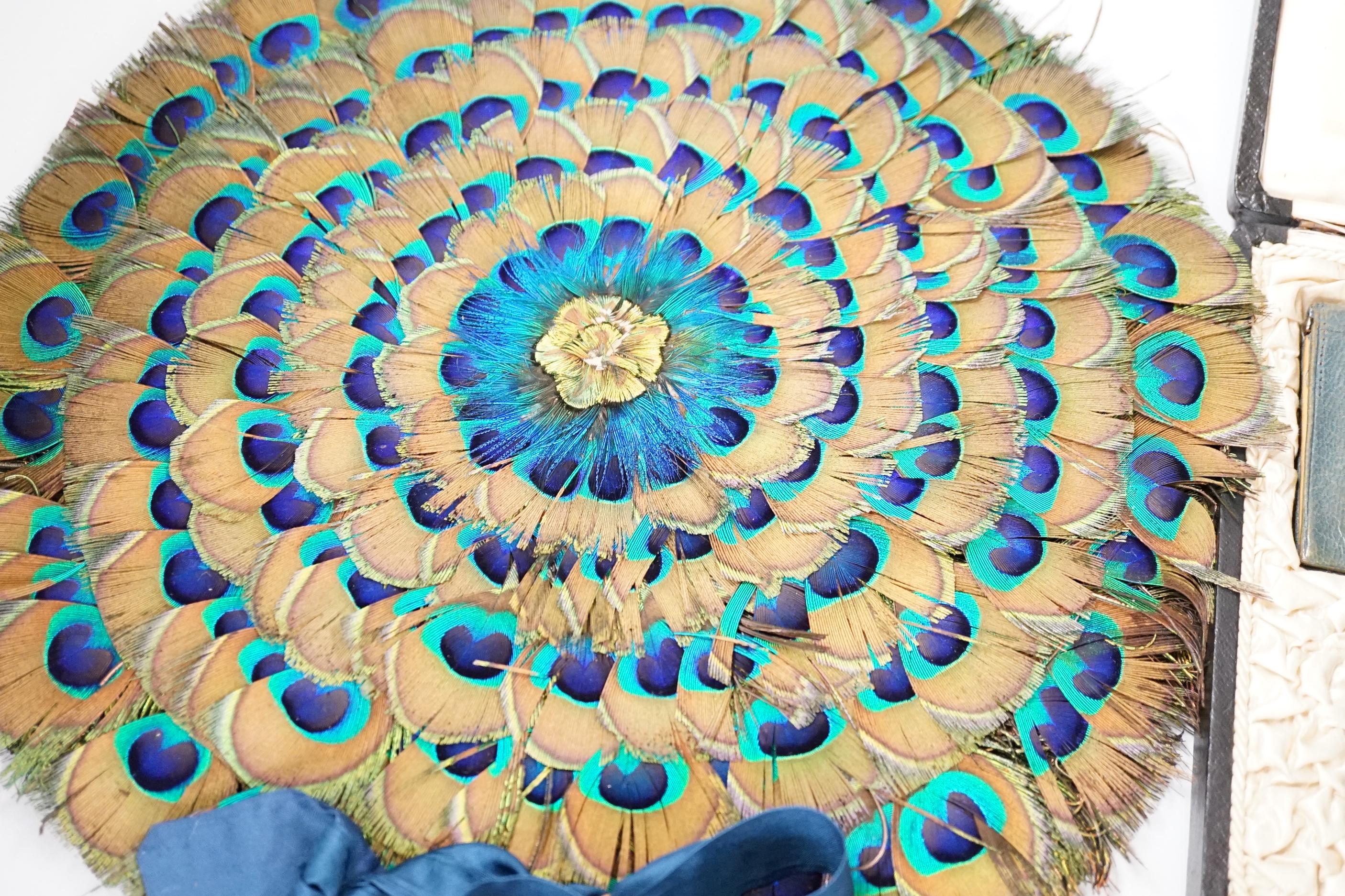 A 19th century peacock feather fan, a cut steel bag and a cased leather and silver mounted purse and card case, fan 41cm high